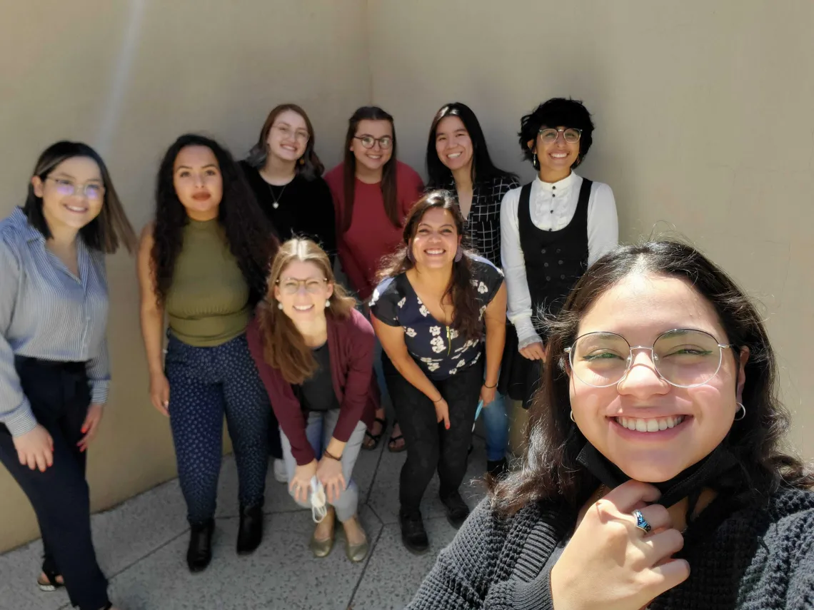 WISE student staff members in a group photo smiling at the camera